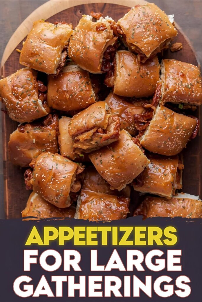 A top-down shot of a large wooden board covered in beautifully arranged BBQ pulled pork sliders, with the text "Appetizers for Large Gatherings" overlaid in a bold, inviting font.