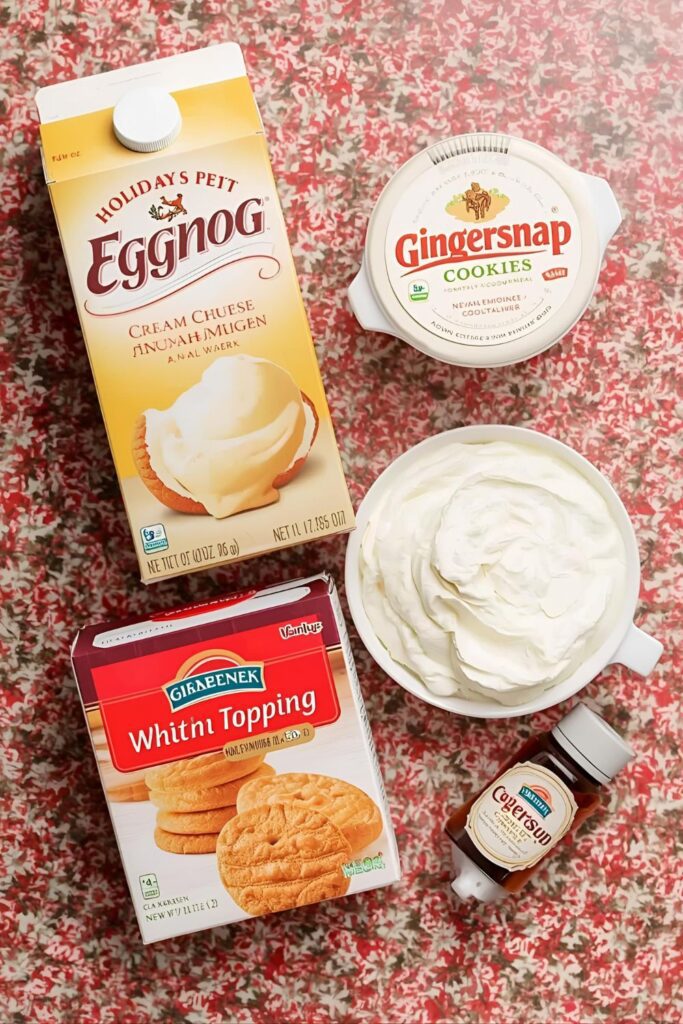 A flat-lay photo collage of the ingredients for an eggnog cheesecake recipe.)