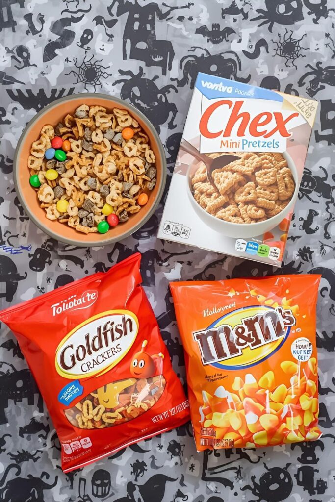 A flat-lay photo collage of the ingredients for a "Monster Munch" snack mix recipe.)