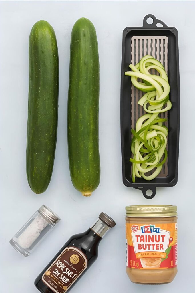 A collage of cucumber noodles ingredients: cucumbers, spiralizer, salt, soy sauce, and tahini.)