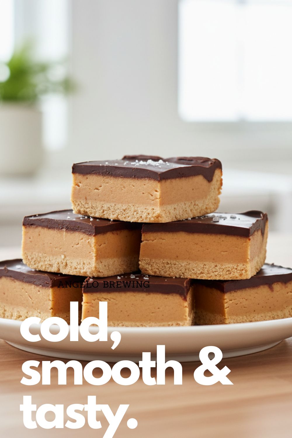 A neat stack of perfectly cut chocolate peanut butter no-bake bars, showing the thick layers, with a text overlay that reads "The Ultimate No-Bake Treat."