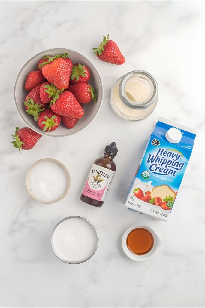 A flat lay collage of ingredients for no-bake strawberry shortcake: fresh strawberries, heavy cream, pound cake, sugar, and vanilla.