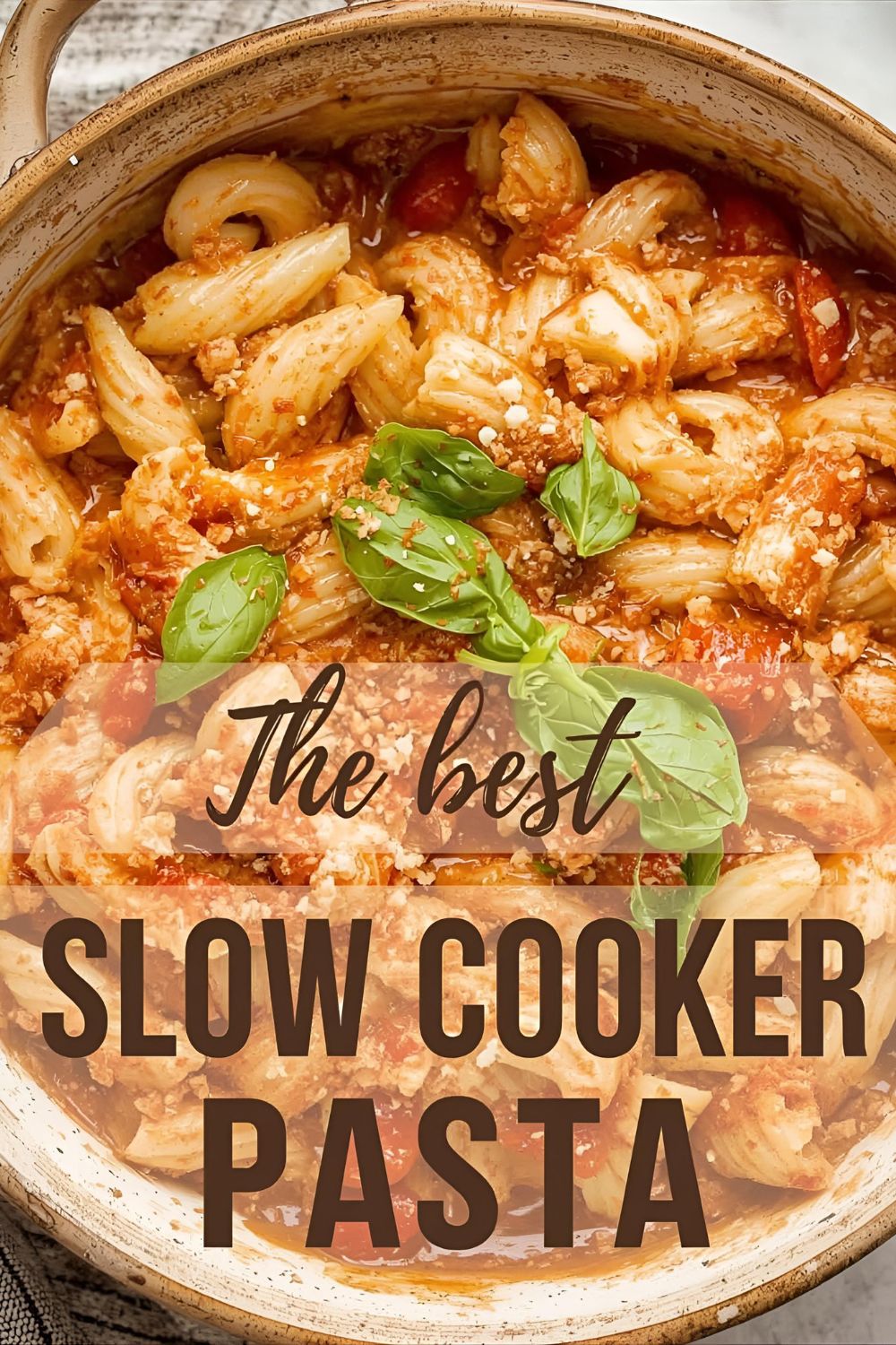 A delicious bowl of creamy slow cooker feta pasta, with the text "The Best Slow Cooker Pasta" overlaid.
