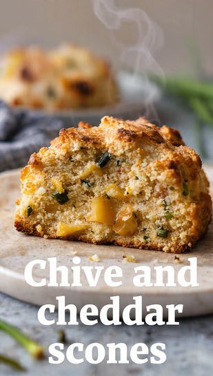 Pinterest image for an easy chive and cheddar scones recipe with a text overlay of the main keyword on a background of a baked scone.