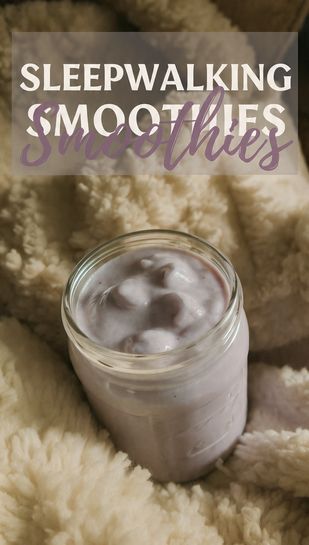 Cozy, dimly lit photo of a lavender-hued, creamy sleep smoothie in a glass jar next to a fluffy pillow. Text Overlay: