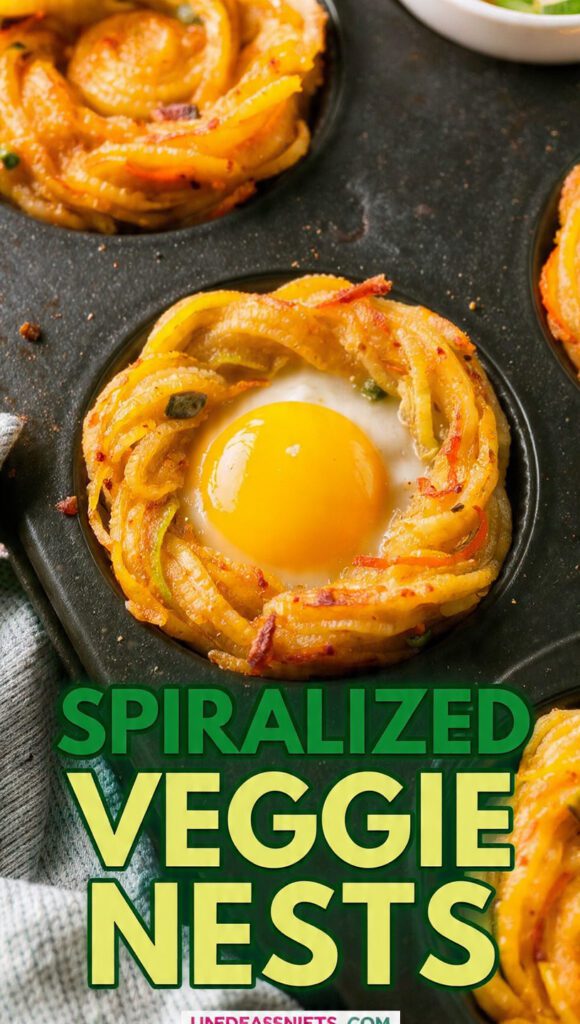 A close-up, vibrant overhead photo of three golden-brown spiralized veggie nests in a muffin tin, one topped with a perfect baked egg, featuring the bold text overlay: SPIRALIZED VEGGIE NESTS.