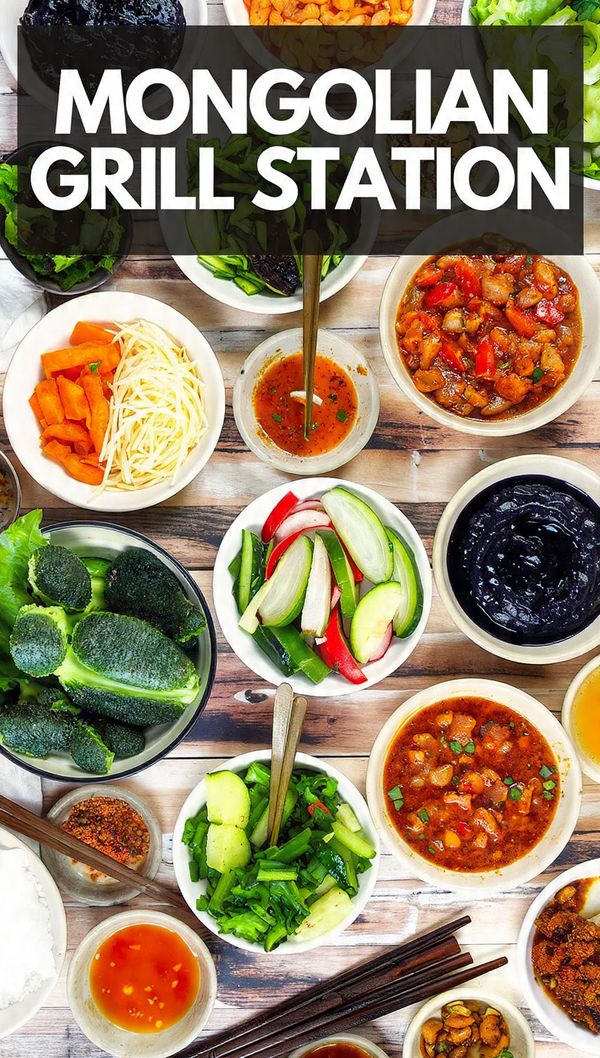 Overhead view of a fully set up Mongolian Grill Station buffet with various bowls of raw meats, veggies, and sauces. Text overlay reads "MONGOLIAN GRILL STATION".