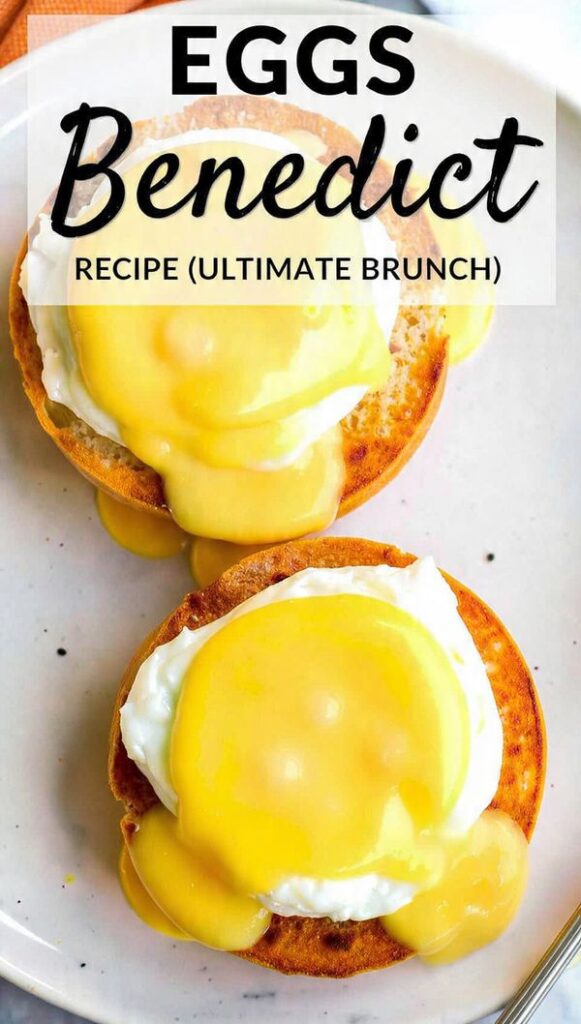 Close-up of two perfect eggs benedict with hollandaise dripping down, ready to be cut.