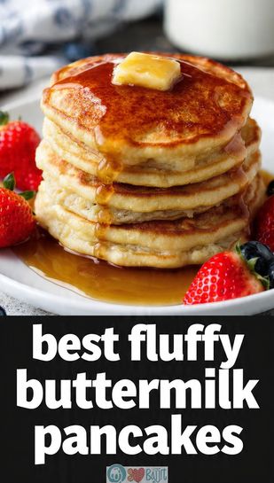 A highly aesthetic stack of three tall, golden-brown fluffy buttermilk pancakes drizzled with maple syrup, topped with melting butter and fresh berries, featuring the main keyword text overlay.