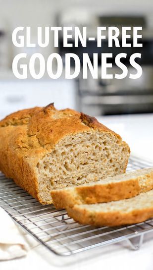 A close-up of a sliced, beautifully baked gluten-free loaf on a cooling rack showing the airy interior, with "GLUTEN-FREE GOODNESS" as a prominent text overlay