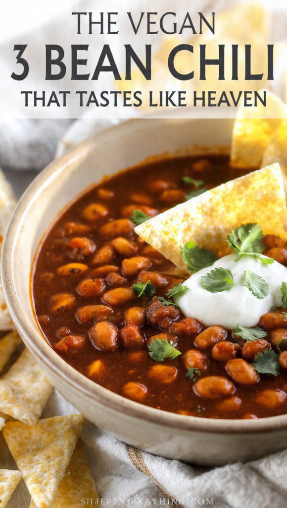 A top-down shot of a vibrant bowl of vegan 3 bean chili with a text overlay of the main keyword