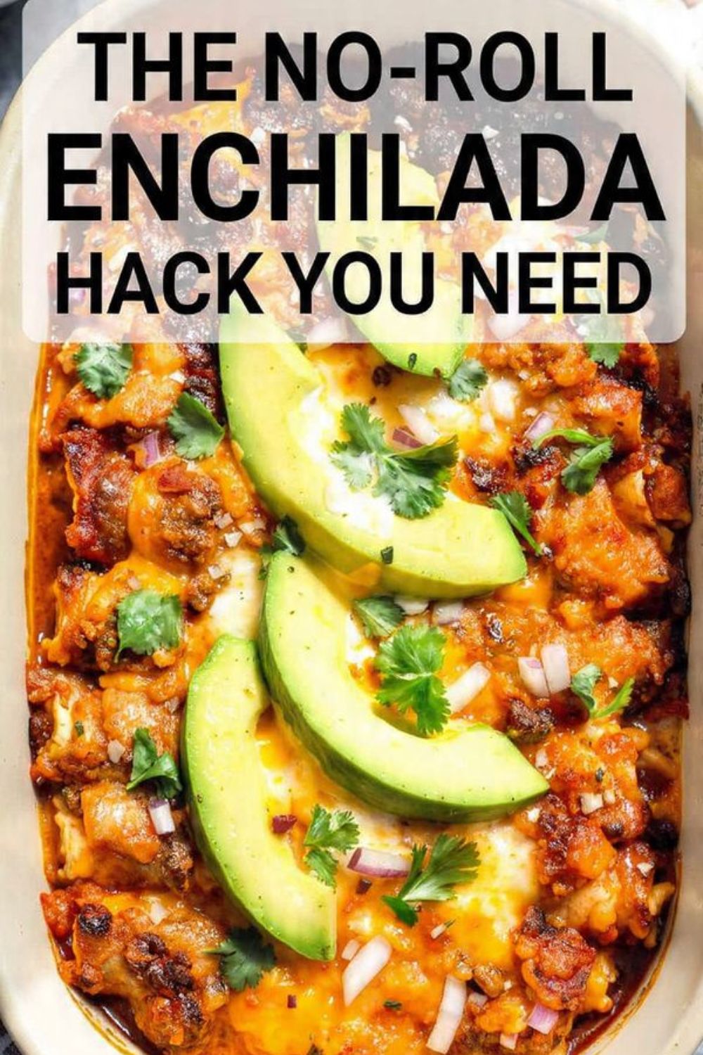 A top-down shot of a cheesy vegetarian enchilada casserole with avocado and cilantro garnish.