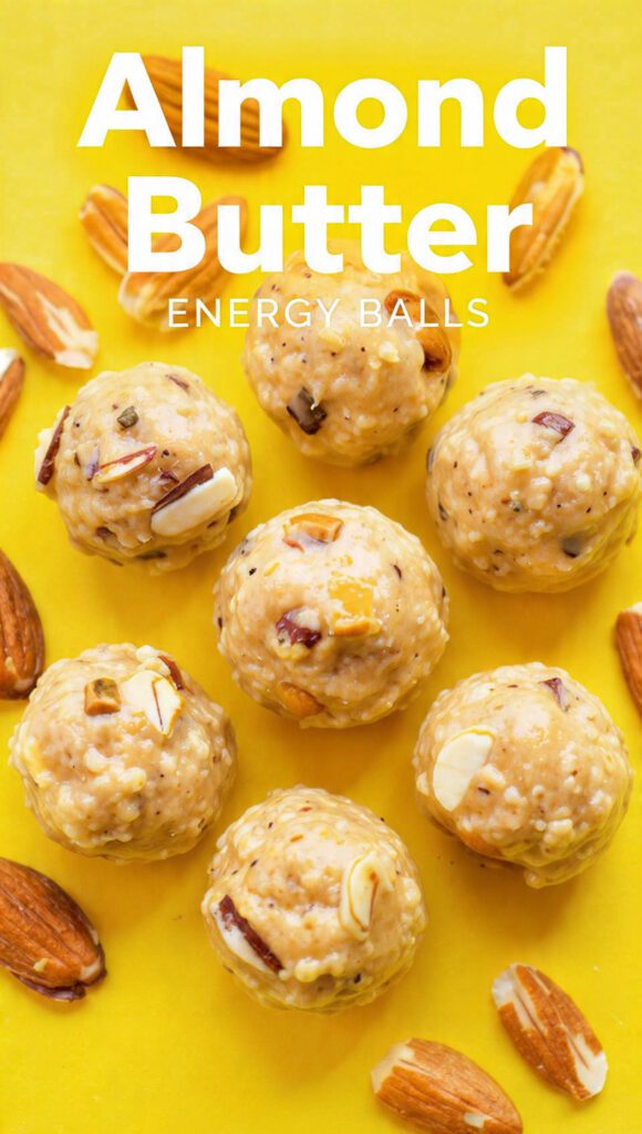 A wooden bowl filled with round almond butter energy balls and text overlay "Almond Butter Energy Balls".