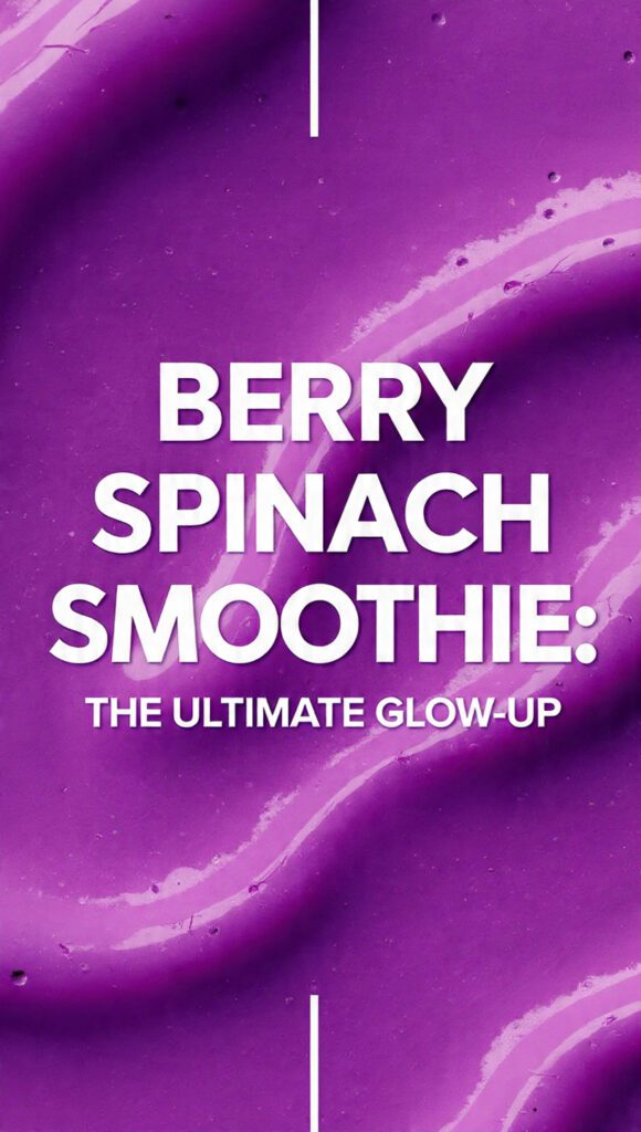 A vibrant purple berry spinach smoothie in a tall glass with a straw and fresh berries on top