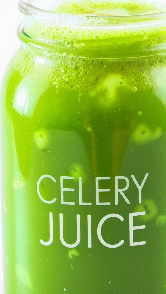 A tall glass of fresh green celery juice with a text overlay for a wellness recipe.
