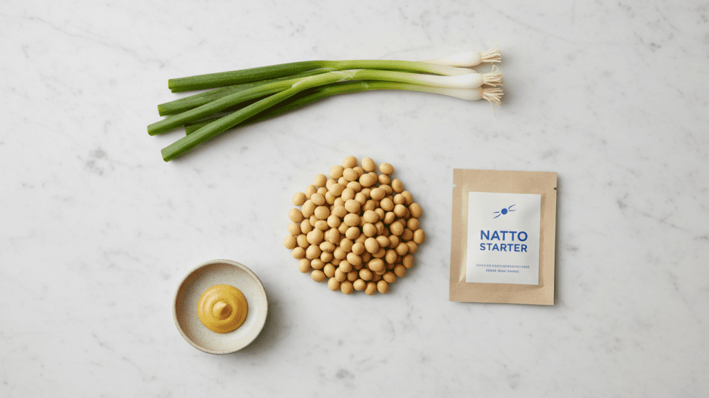 A collage of ingredients: dried soybeans, natto starter, green onions, and mustard.