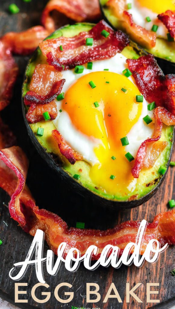 A close-up of a baked avocado with a perfectly cooked egg in the center.