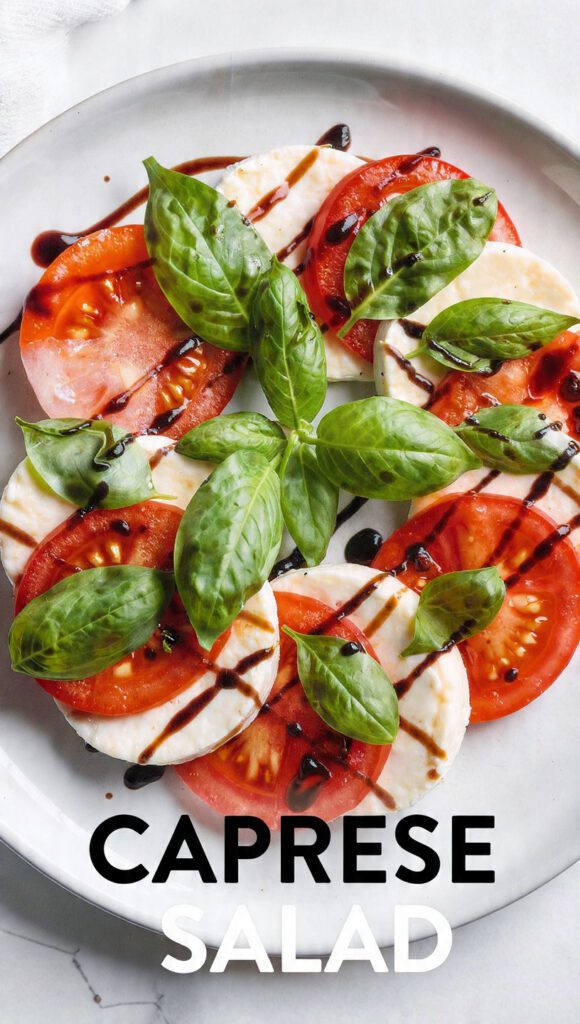 A beautiful platter of authentic homemade Caprese salad with balsamic glaze.